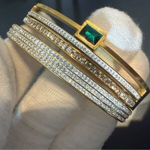 Elegant Gold and Silver Bracelet with Green Gemstone